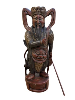 statue of a man with a long beard holding a cane