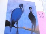 a picture of two birds that are standing on a table