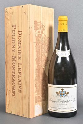 a bottle of wine sitting next to a wooden box