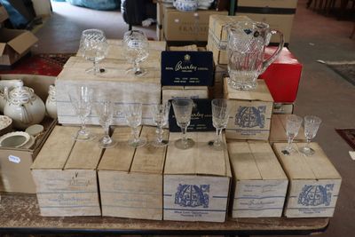 many boxes of wine glasses sitting on a table