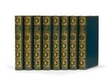 un coffret de cinq livres aux couvertures dorées et bleues