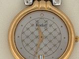 an image of a close up of a wrist watch on a white surface