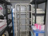 a metal ladder in the middle of a room filled with boxes