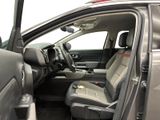 the interior of a car with the driver ' s seat folded down