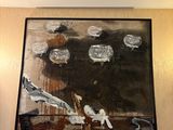 un tableau accroché au mur d'une chambre d'hôtel
