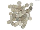 a pile of silver coins on a white surface