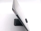 a close up view of a cell phone on a stand