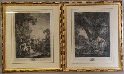 deux reproductions encadrées représentant un homme et une femme dans un décor boisé