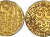 a gold coin with an image of a man and a woman on it