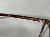 the glasses are made out of tortoises and have a clear lens