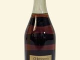an image of a bottle of alcohol sitting on top of a table