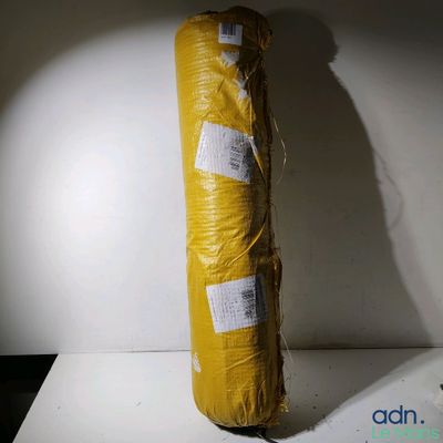 a large roll of yellow tarp sitting on a table