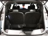 two seats in the back of a car with the trunk open