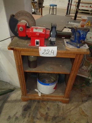 a small table with a red machine on top of it