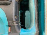 a blue and black electric drill in a blue box