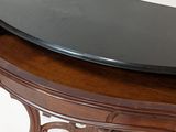 an image of a black marble top on a wooden table