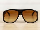 a close up of a pair of sunglasses on a table