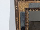 a mirror that is sitting on the floor in a room