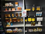 many different types of skin care products displayed on the shelves
