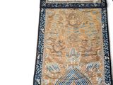a large oriental rug on a white surface