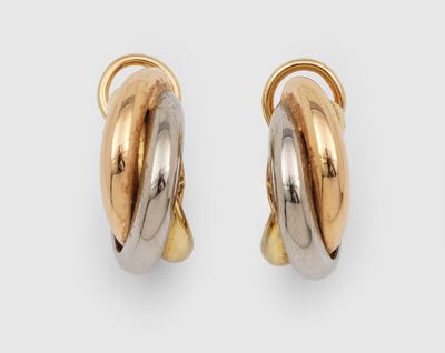 une paire de boucles d'oreilles créoles bicolores, en or et en argent