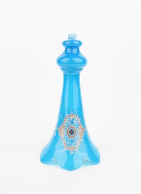 an image of a blue glass perfume bottle on a white background