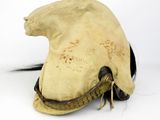 an old helmet with a cat ' s head on it on a white surface