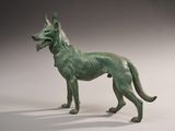 statue of a dog with a collar on a white background