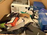 a cardboard box filled with electronic equipment and other items