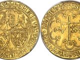 a gold coin with an image of a man and a cross on it