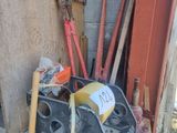 a pile of tools sitting outside of a building