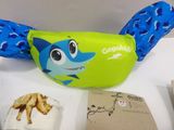 a blue and green bag with a picture of a shark on it