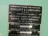 a sign on the side of a green machine