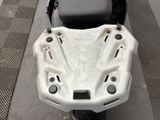 a motor scooter parked on the side of the street