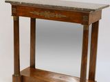 a small wooden table with a marble top on it