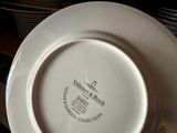 a person holding a plate with a picture on it