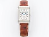 a silver watch with a brown leather strap on a white background