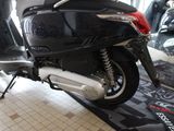 a motor scooter that is on display in a showroom