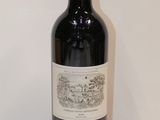 a bottle of wine that is sitting on a table