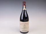 a bottle of wine that is sitting on a table