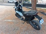a motorcycle that is parked on the side of the road