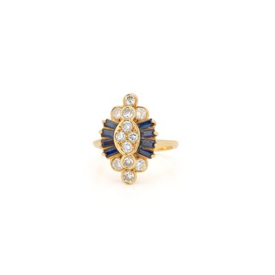 an 18k yellow gold ring with sapphire and diamonds