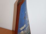 a picture of a picture of a sailboat on a shelf