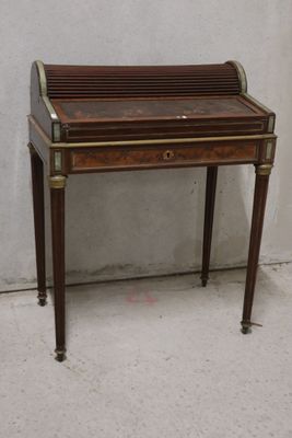 a small desk with a drawer on top of it