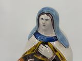 a figurine of a woman holding a child