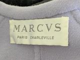 marc v ' s label on the back of a gray shirt