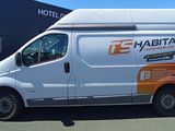 a white van that is parked in a parking lot