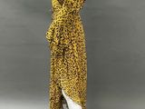a mannequin mannequin wearing a leopard print dress