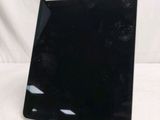 an image of a black tablet computer sitting on top of a white surface