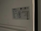 a picture of a white refrigerator with a label on it